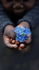 child holding flowers stockcake